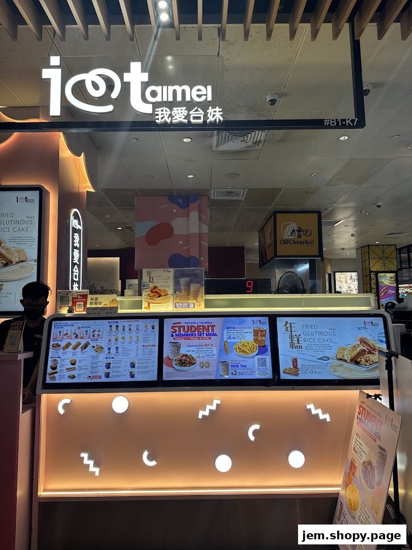 I Love Taimei shop front with illuminated sign and digital menus displaying food and drinks.