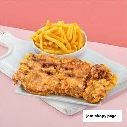 Crispy fried chicken and golden french fries served on a white board.