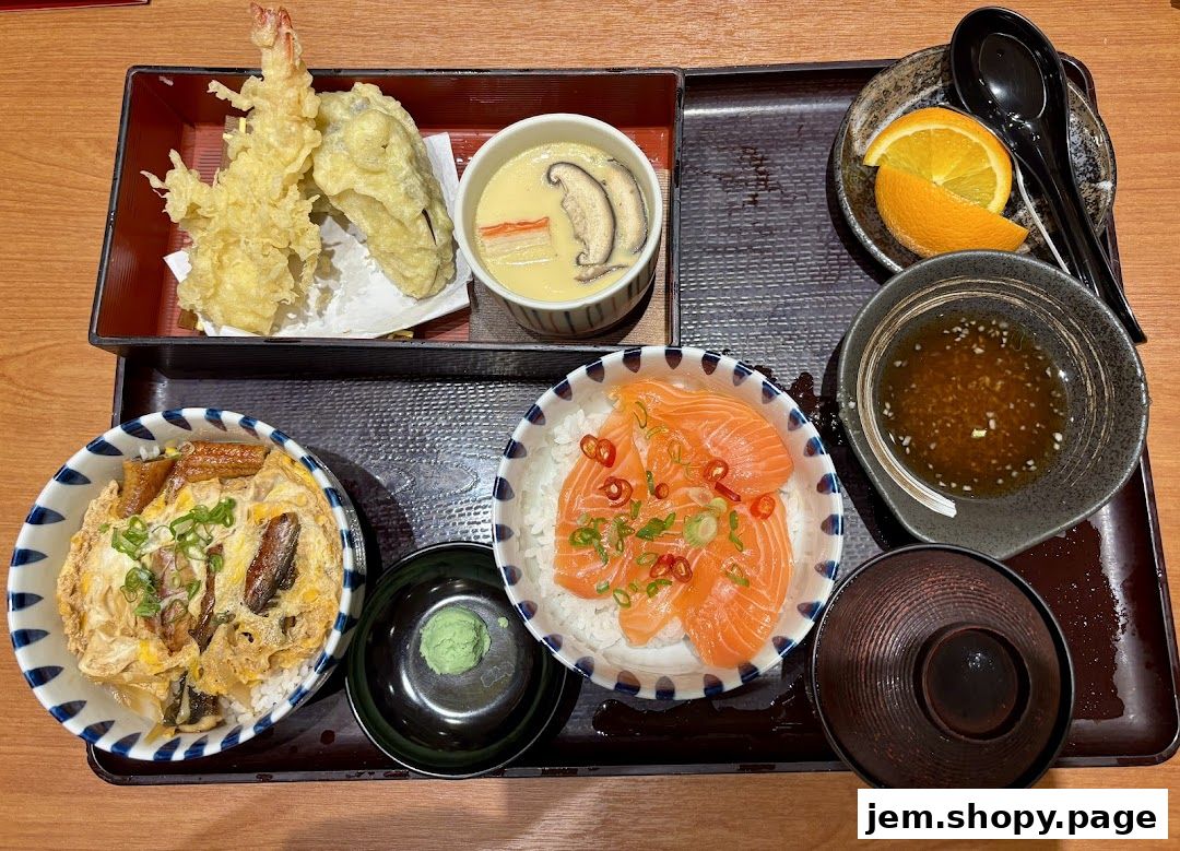 A Japanese meal set featuring tempura, chawanmushi, salmon donburi, and unagi donburi.