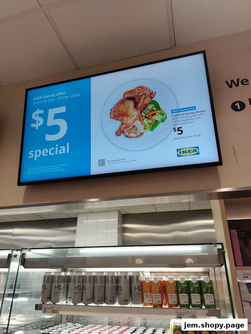 A digital menu board displays a $5 special offer for a fried half spring chicken meal at IKEA.