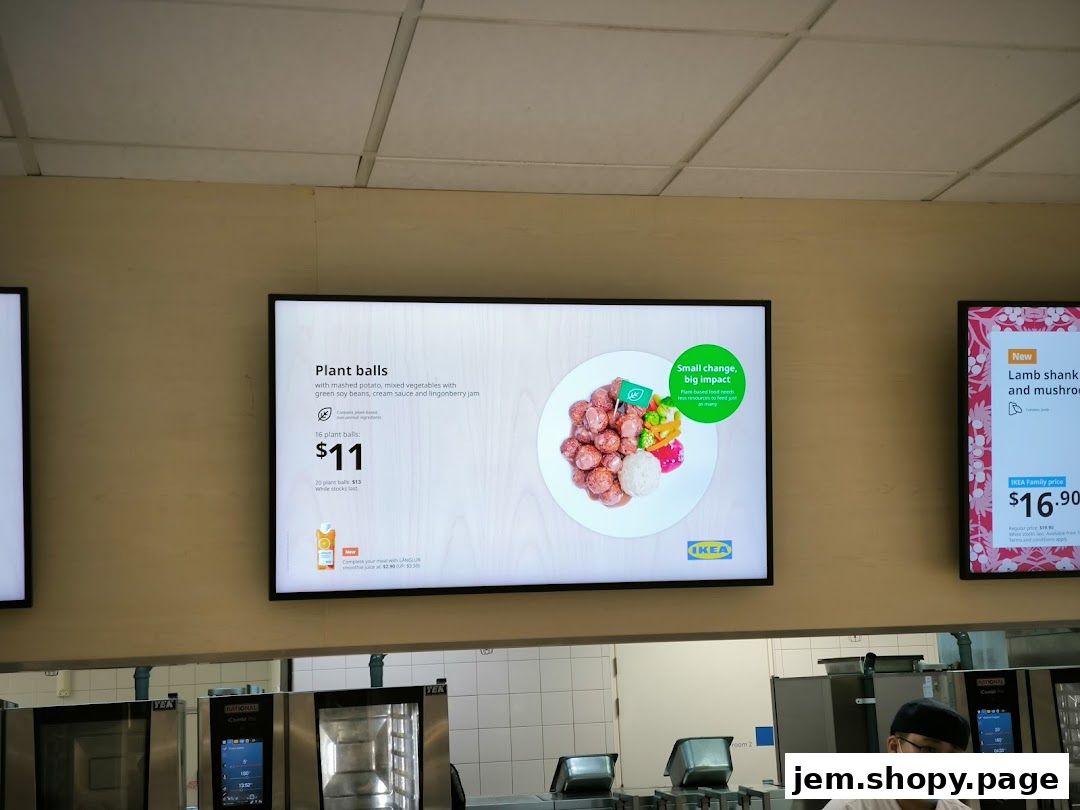 Digital menu board displaying IKEA's plant balls and lamb shank dishes.