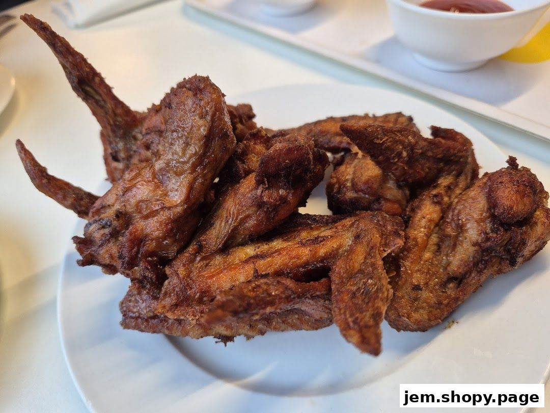 A plate of crispy, golden-brown fried chicken wings served at IKEA Jurong Restaurant.