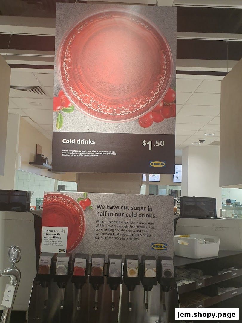 A sign advertising cold drinks with a price of $1.50 and a drink dispenser.