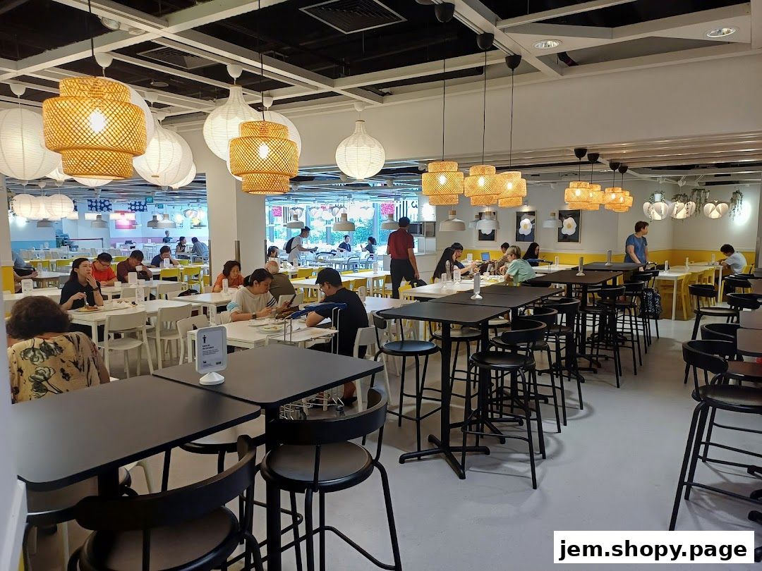 Interior view of a spacious IKEA restaurant with many tables and chairs, and people dining.