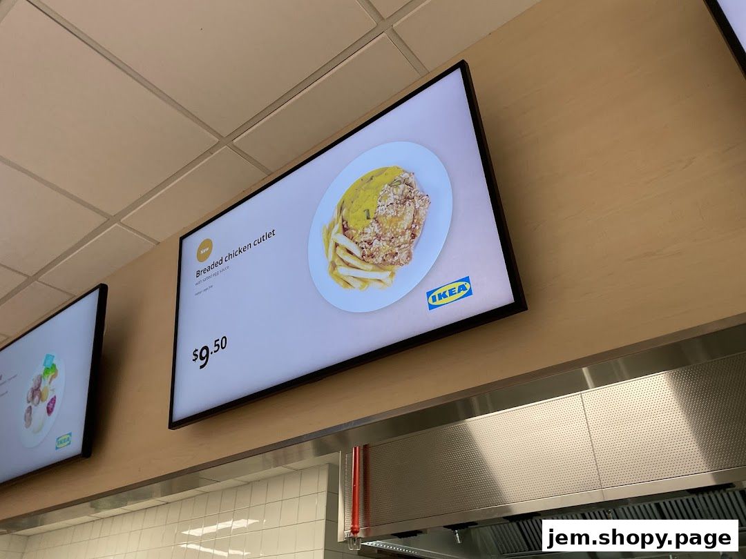 Digital menu board displaying a breaded chicken cutlet with fries and sauce.