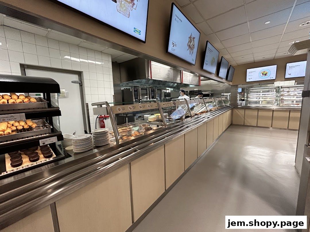 Interior view of the IKEA Jurong Restaurant serving area with food displays and digital menus.