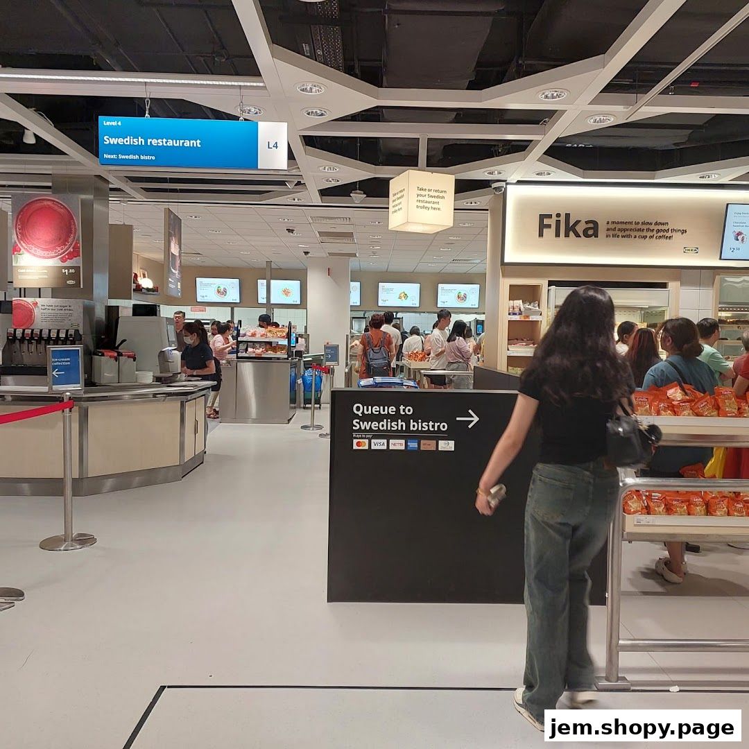 Interior view of the IKEA Jurong Swedish restaurant and bistro area with signage and queues.