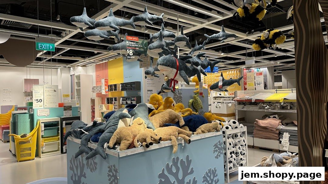 A display of plush sea creatures and other toys hanging from the ceiling and on shelves.