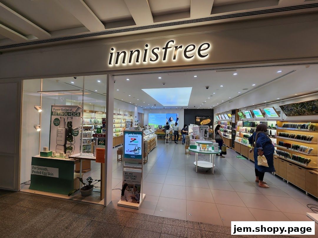 The exterior of an Innisfree cosmetics store with products displayed inside and outside.