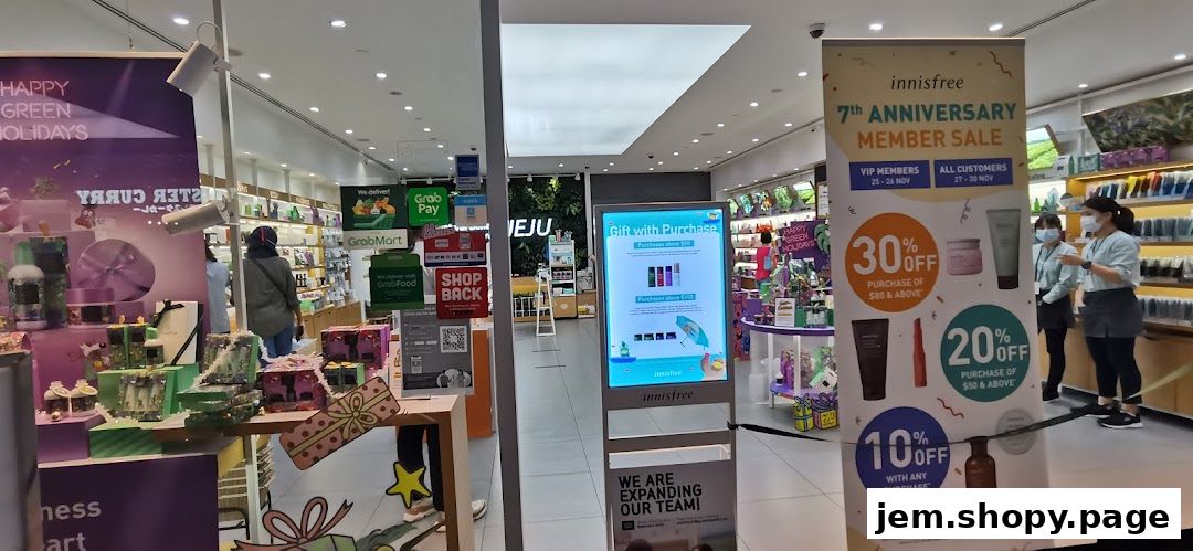 Innisfree shop interior with promotional banners and product displays.