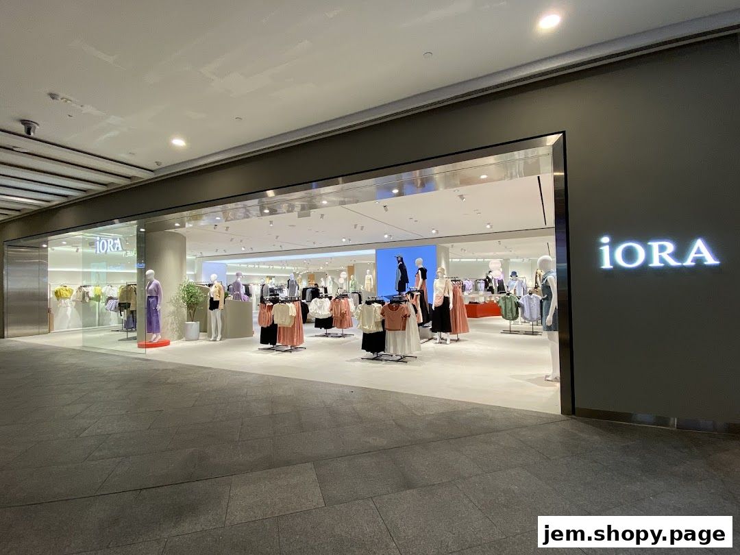 The exterior of the iORA clothing store, showcasing mannequins and apparel displays.