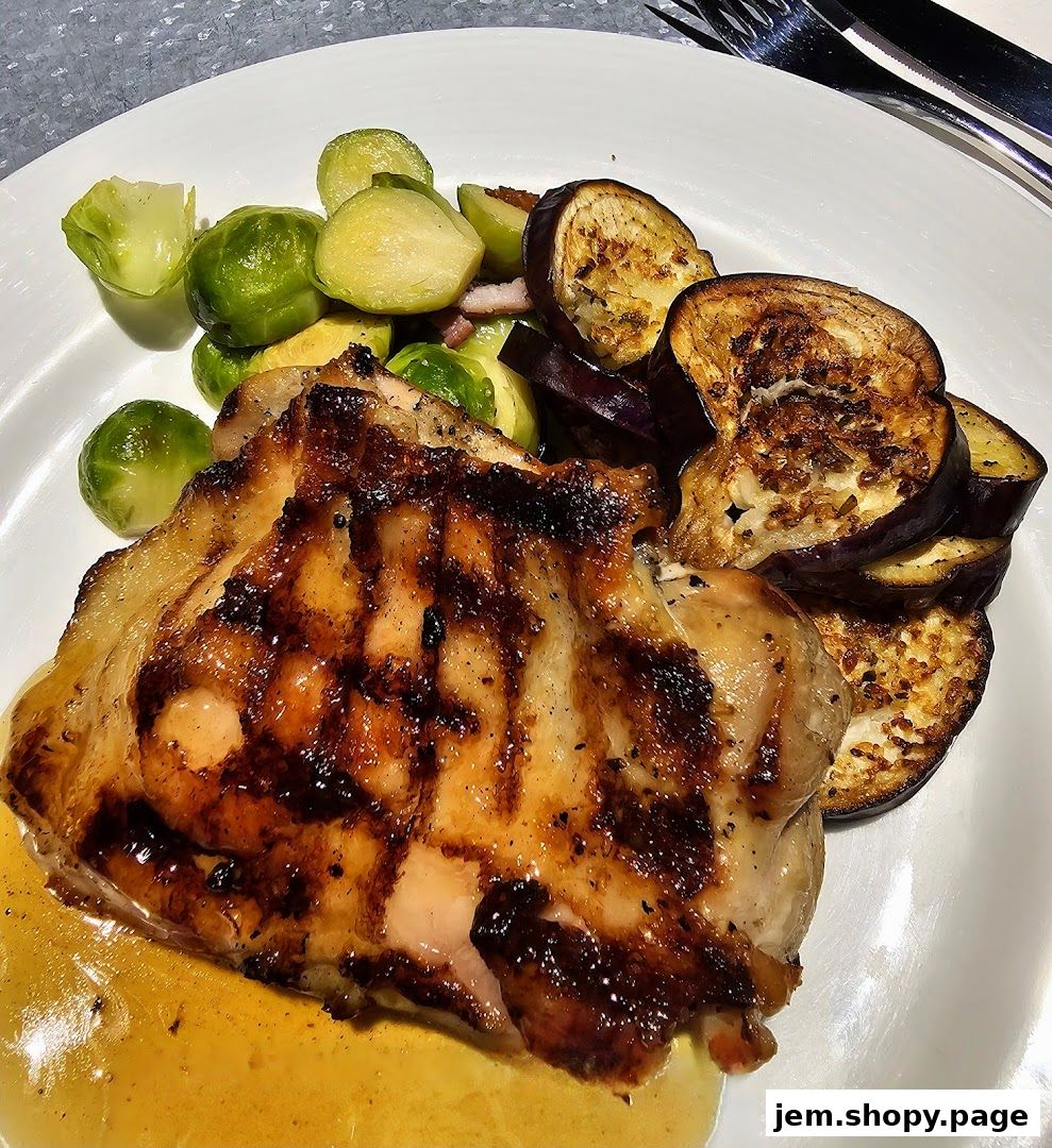 A grilled chicken thigh served with Brussels sprouts and fried eggplant slices.