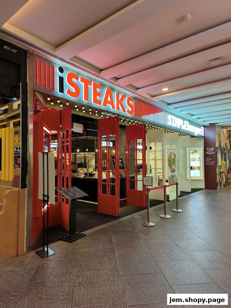 The exterior of the iSTEAKS restaurant with its prominent red and white signage.