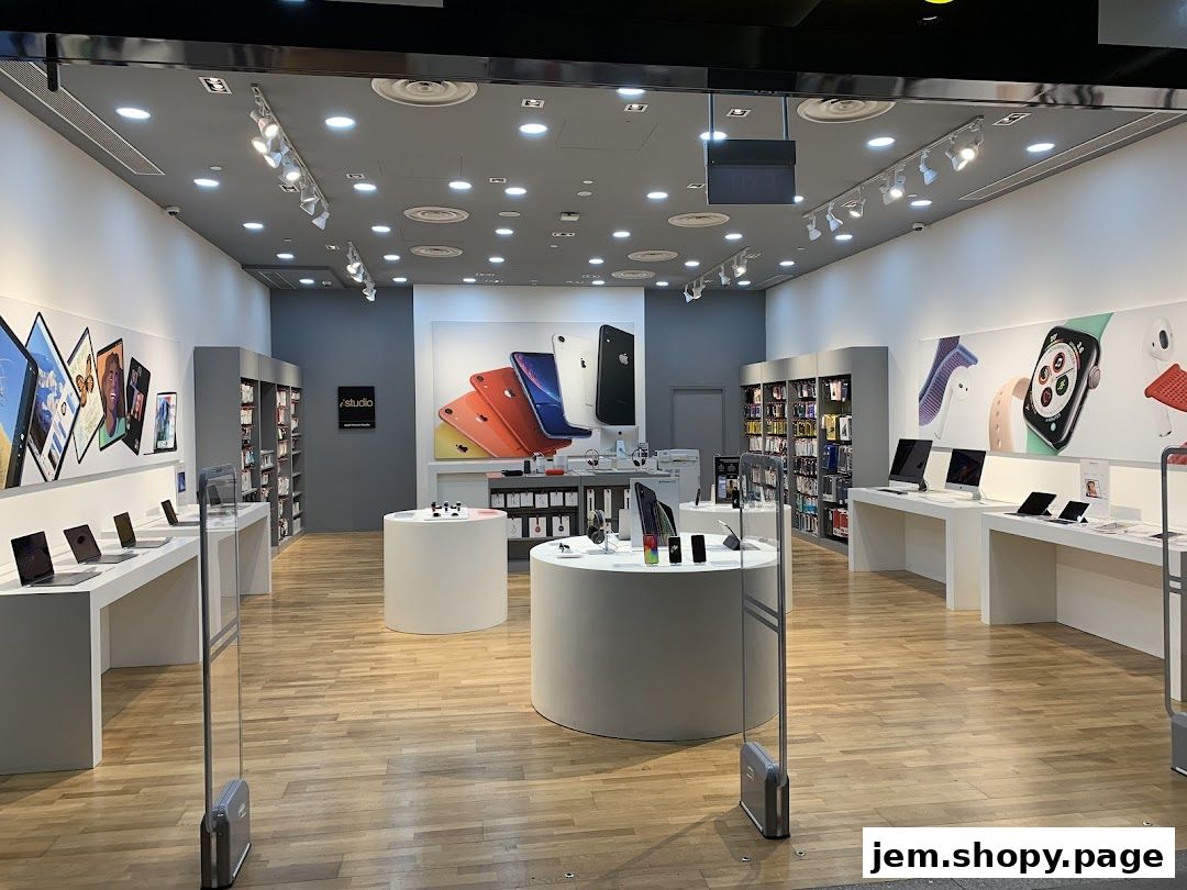 Interior view of an iStudio electronics store showcasing Apple products.