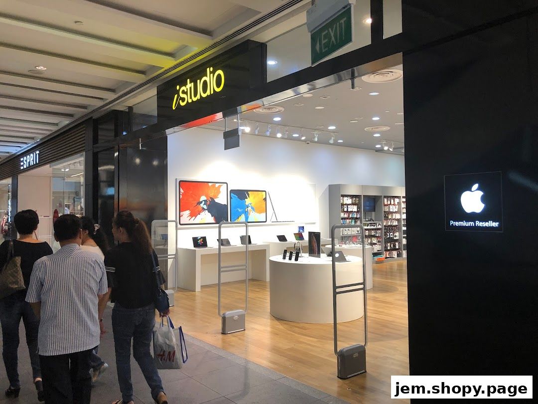 The entrance to iStudio JEM, an Apple Premium Reseller, showcasing Apple products.