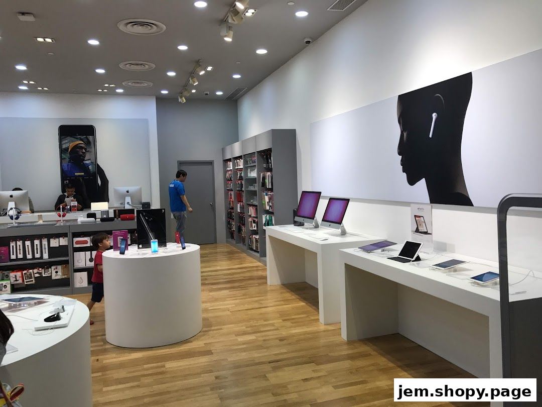 Interior of an Apple-themed electronics store showcasing products and displays.