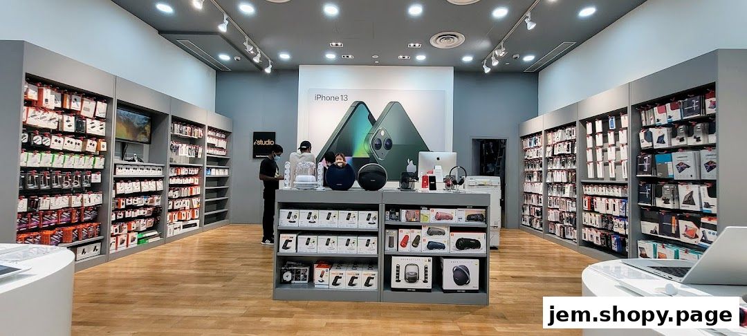 Interior of iStudio JEM, showcasing iPhone 13 and various tech accessories on display.