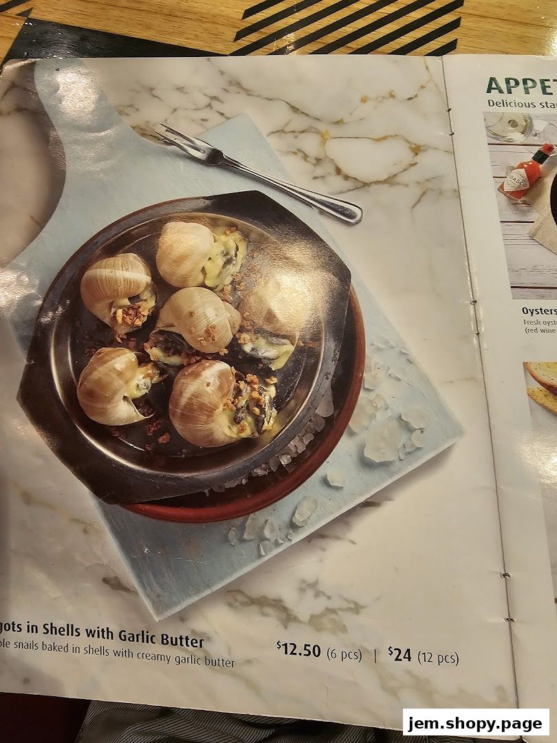 A menu page featuring escargots in shells with garlic butter and oysters.