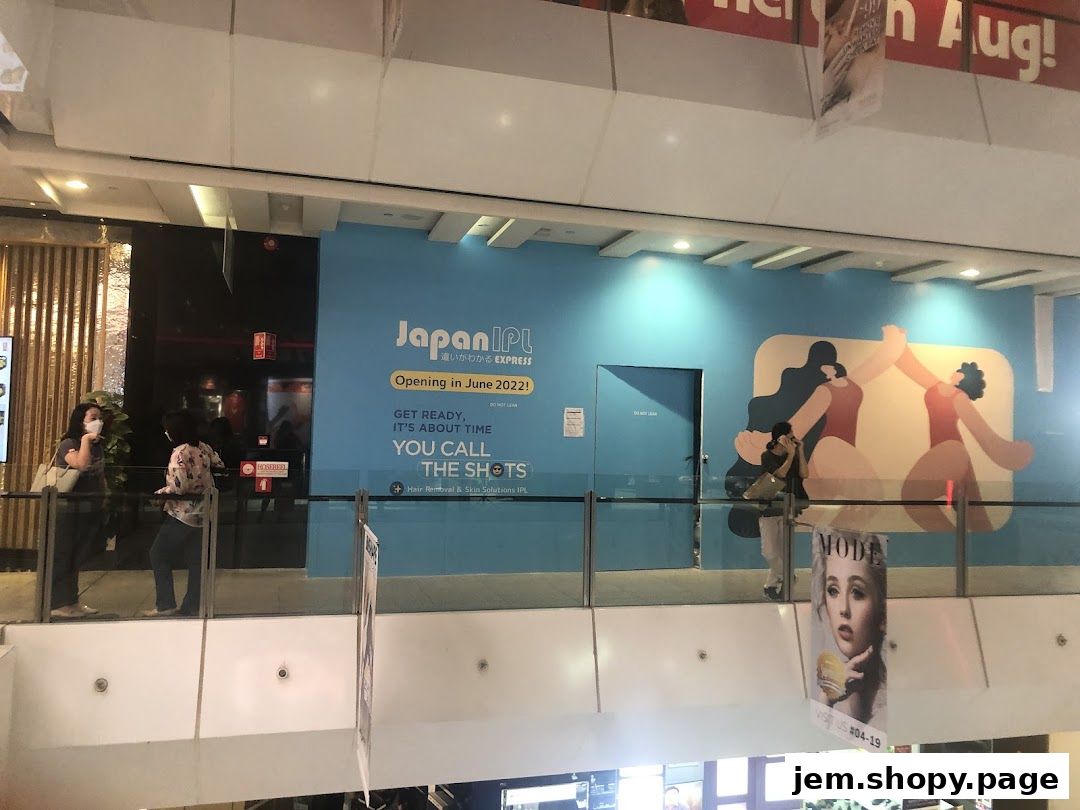 Japan IPL Express shop front with opening announcement and graphic art.