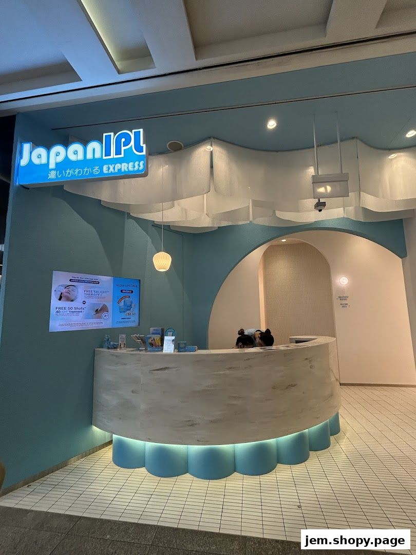 The entrance of Japan IPL Express, featuring a modern reception desk and promotional screen.