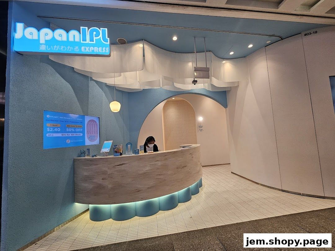 The entrance of Japan IPL Express with a reception desk and promotional screen.