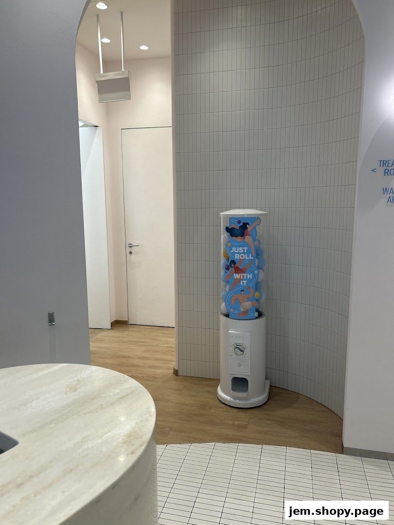 Interior shot of a modern clinic with a gumball machine and minimalist decor.