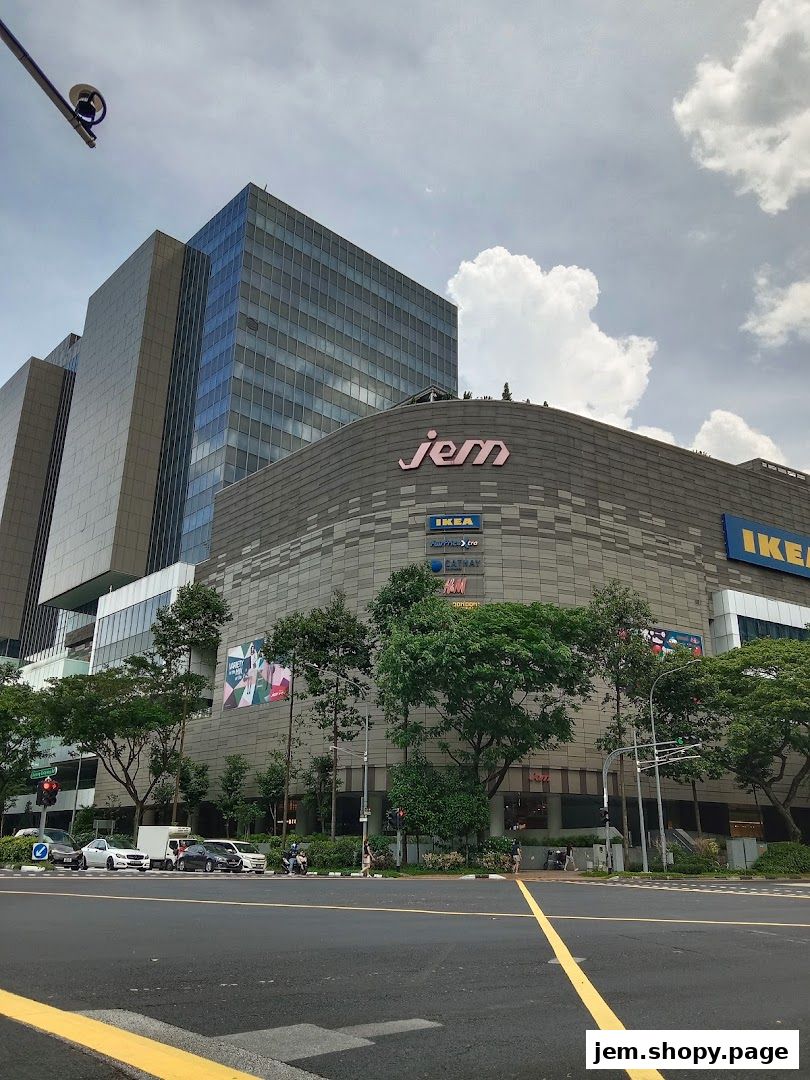 Exterior view of the Jem shopping mall with various retail stores visible.