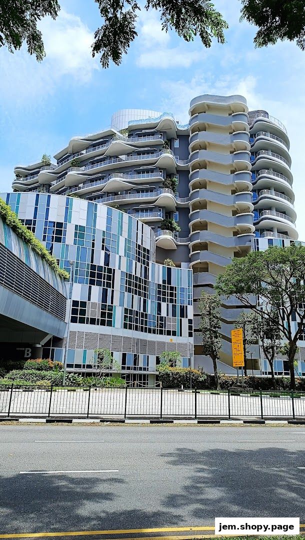 Modern architectural building with unique wavy balconies and a colorful facade.