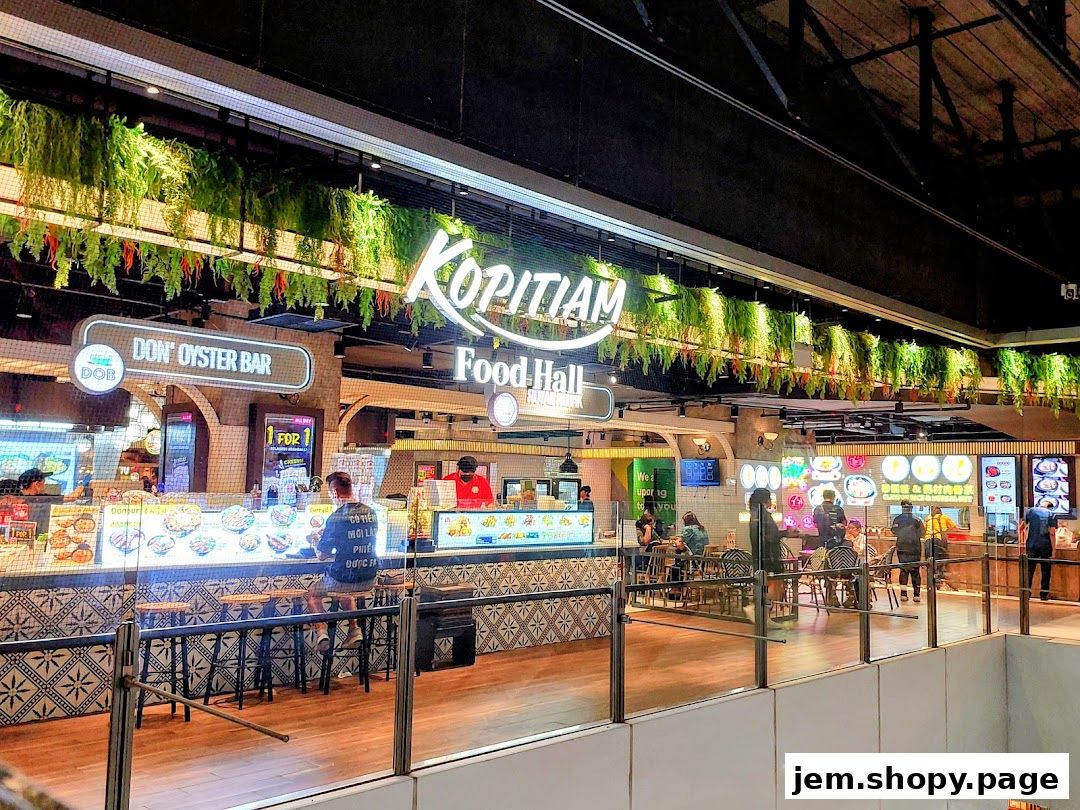 A food hall with multiple food stalls, including 'Don' Oyster Bar' and 'Kopitiam Food Hall'.