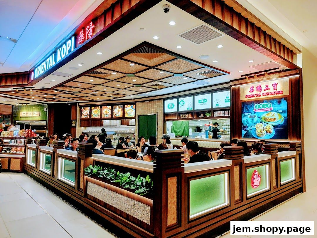 Interior view of Oriental Kopi restaurant with customers dining and food displays.