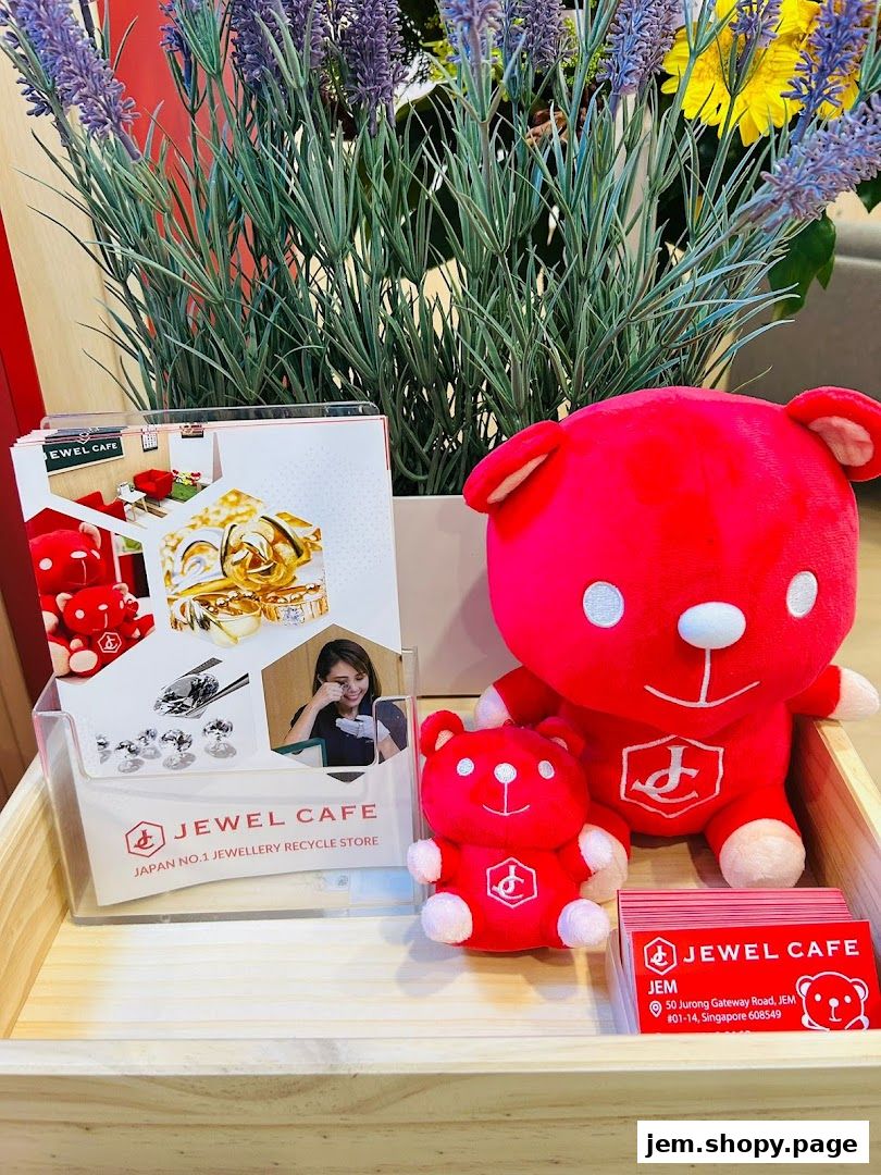 Jewel Cafe display with plush bears, brochures, and business cards.