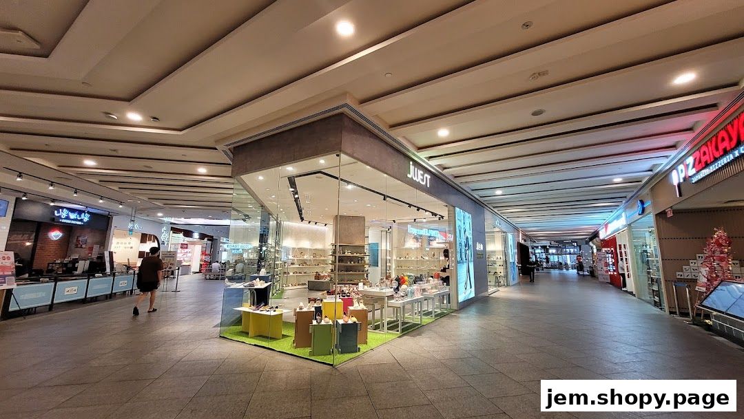 The exterior of the Jwest shoe store, showcasing a modern display of footwear.