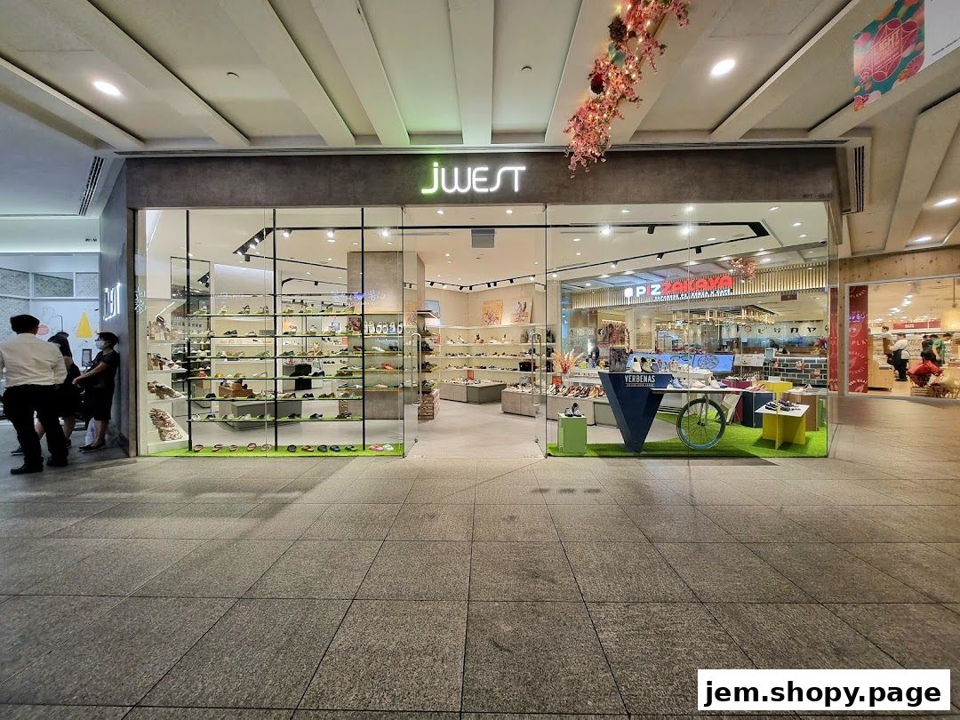 The Jwest shoe store features a modern storefront with a wide selection of footwear displayed on shelves.