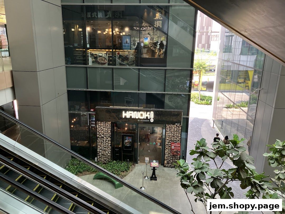The exterior of the 'HANOK' restaurant, a modern eatery with stone accents and a prominent sign.
