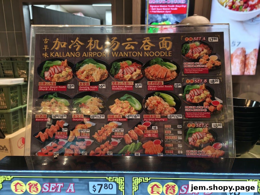 A menu board for Kallang Airport Wanton Noodle featuring various noodle and dumpling dishes.