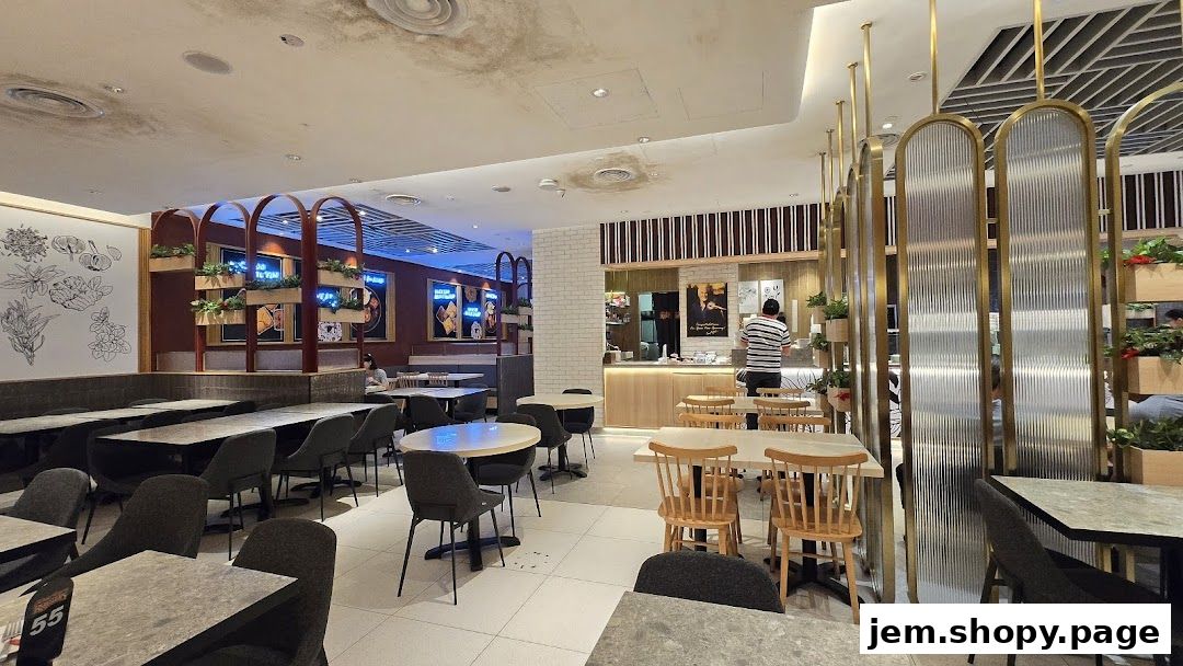Interior view of Kenny Rogers Roasters Singapore with seating and counter area.