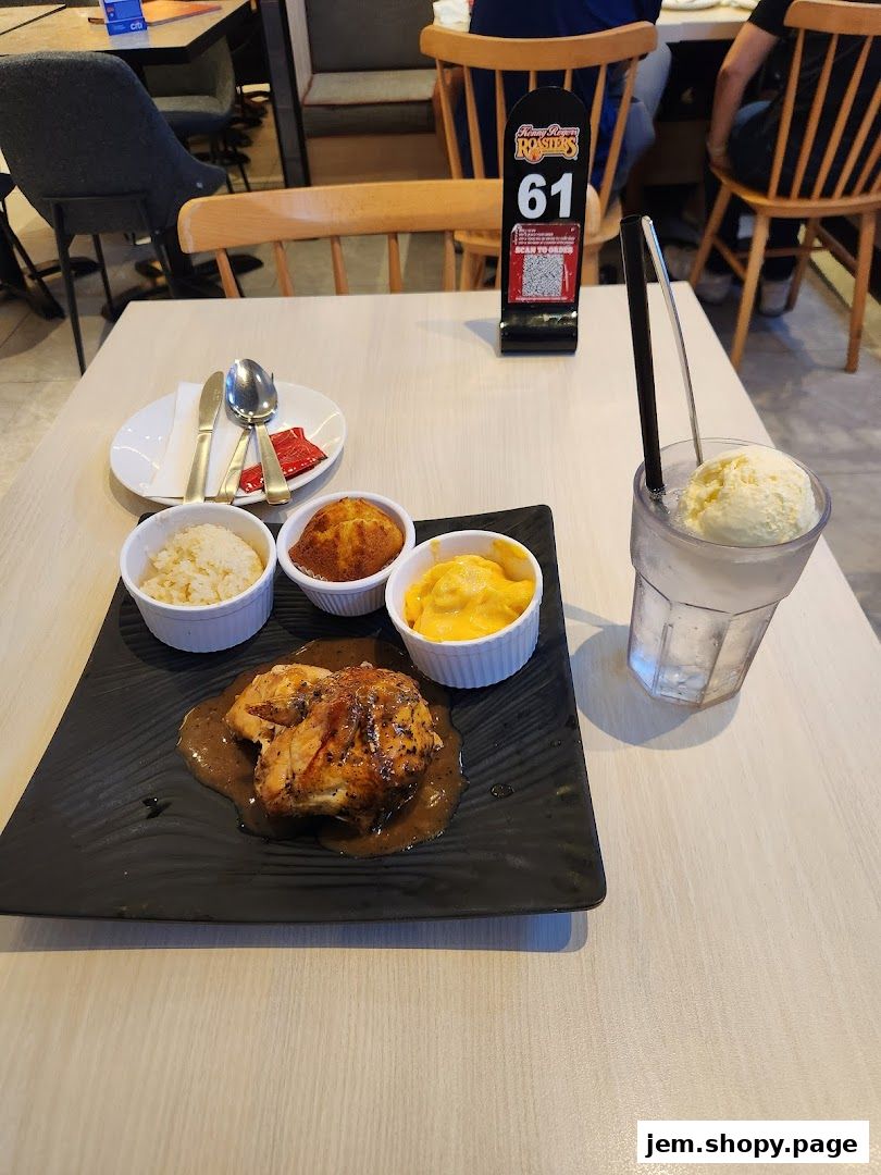 A delicious meal from Kenny Rogers Roasters featuring roasted chicken, sides, and a drink.