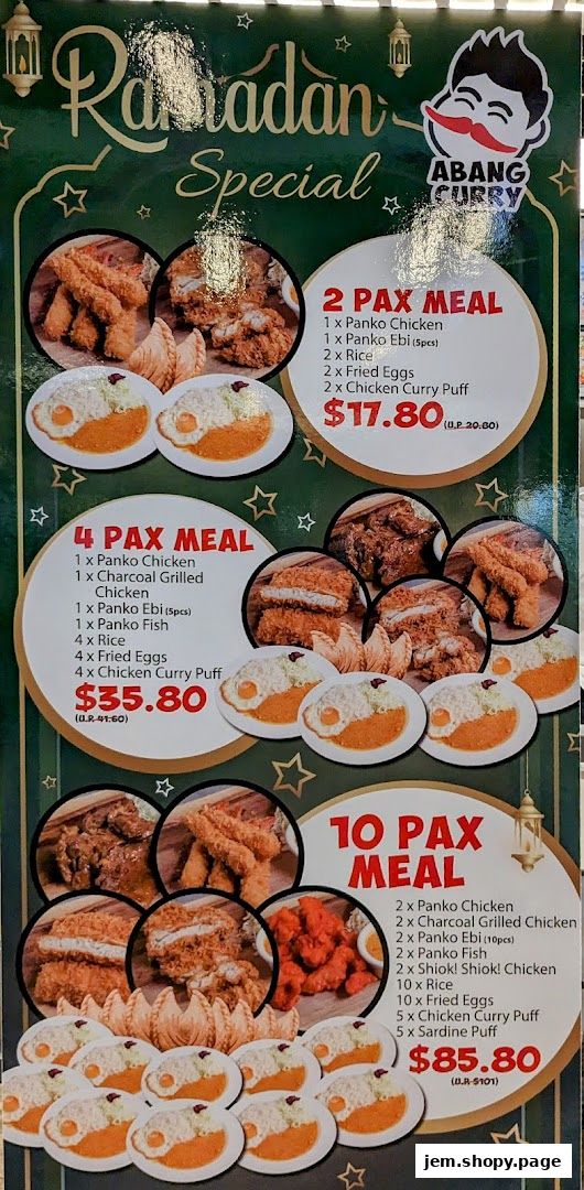 A menu board for Ramadan specials featuring various meal packages with fried chicken, fish, and rice.