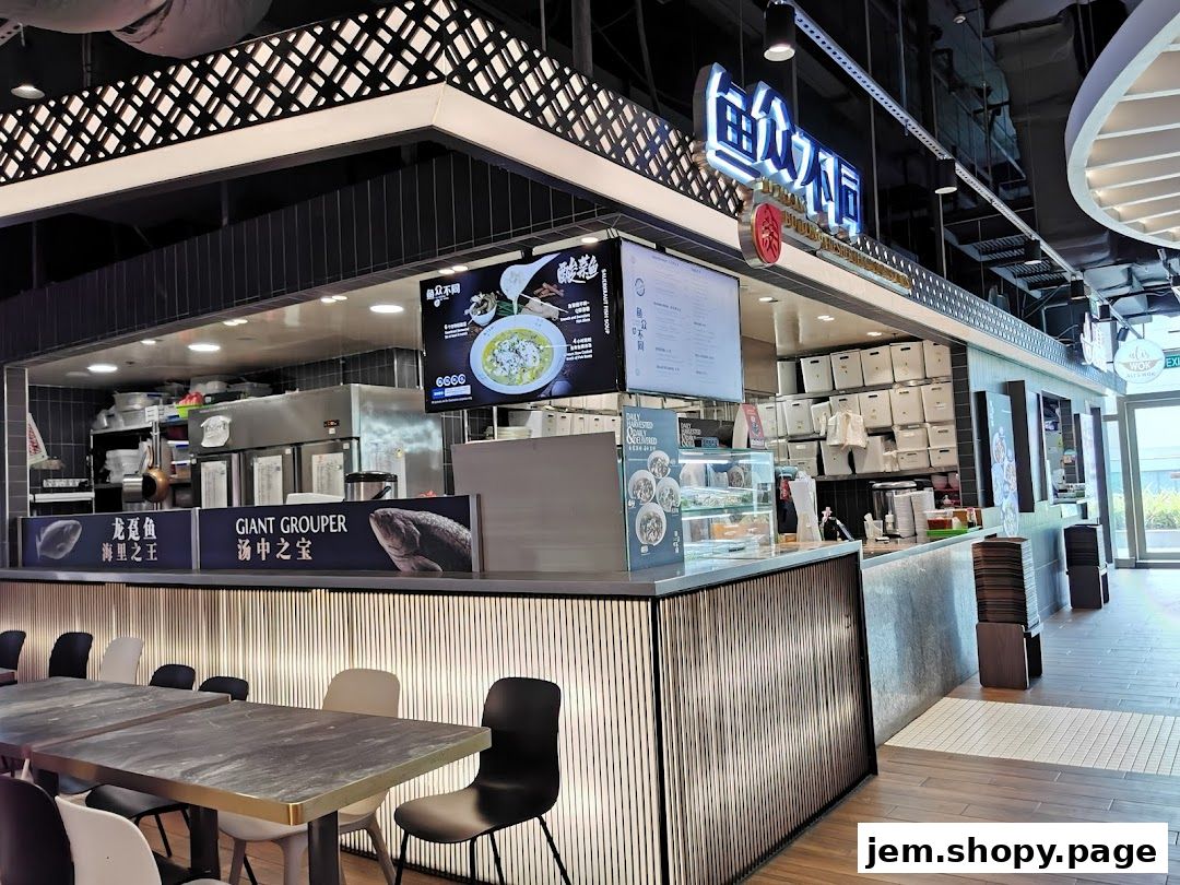 Interior view of a food stall with seating, a counter, and a menu display.