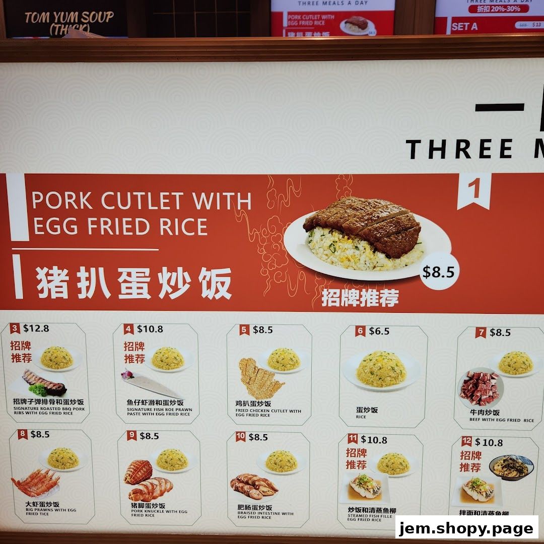 A menu board displaying various egg fried rice dishes with prices and images.