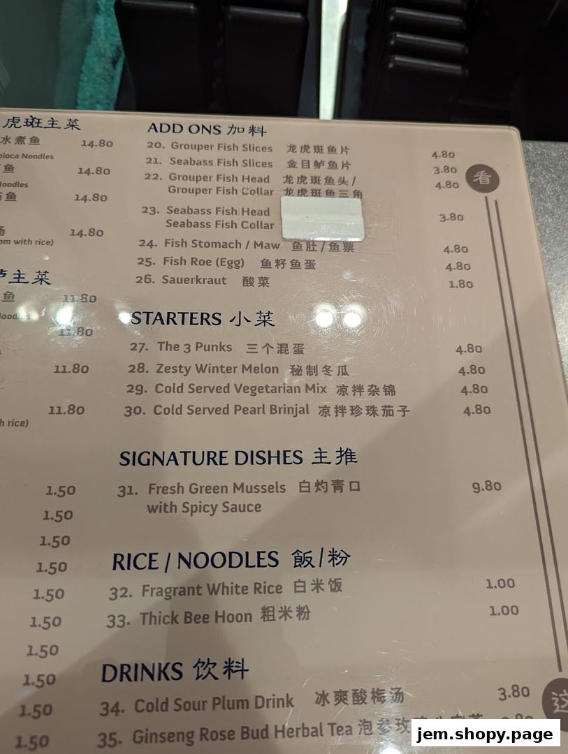 A menu from Kopitiam Food Hall featuring main courses, starters, signature dishes, rice, noodles, and drinks.