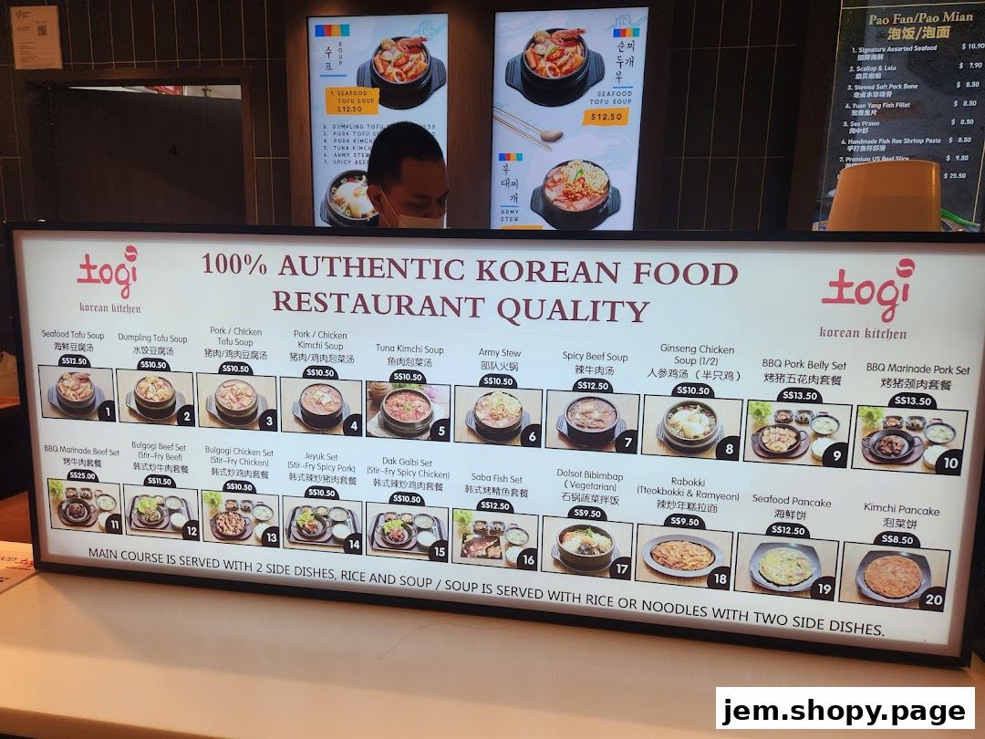 A brightly lit menu board displaying various Korean dishes with prices and images.