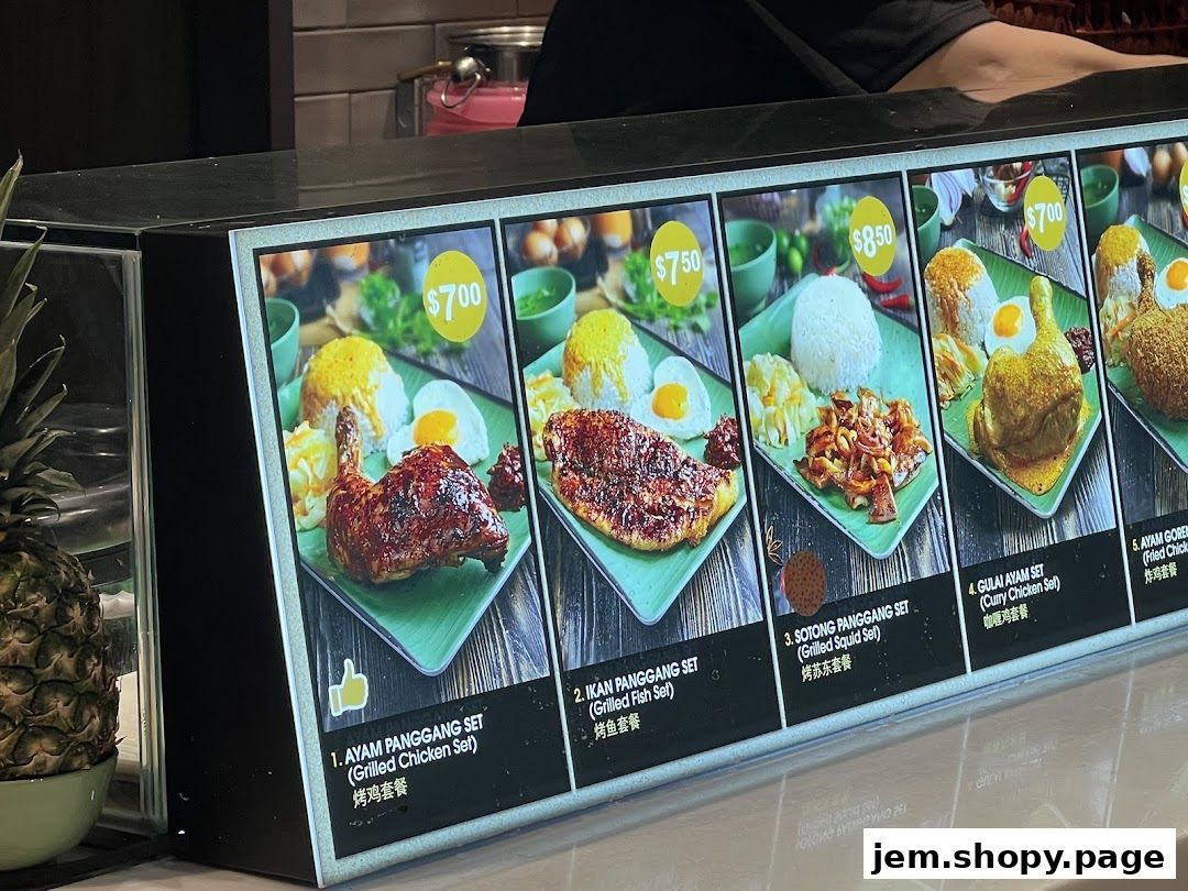 A display of various food sets with prices and images at Kopitiam Food Hall.