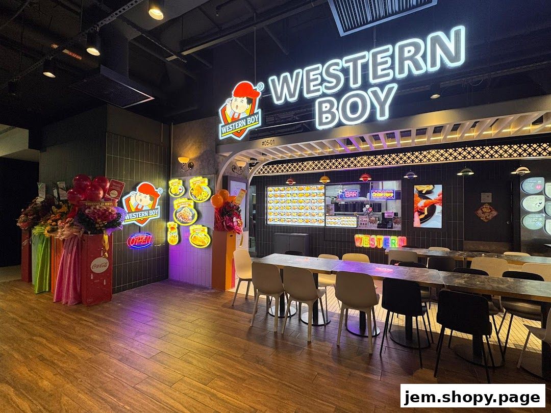 Interior of a Western Boy food stall with seating and illuminated signage.