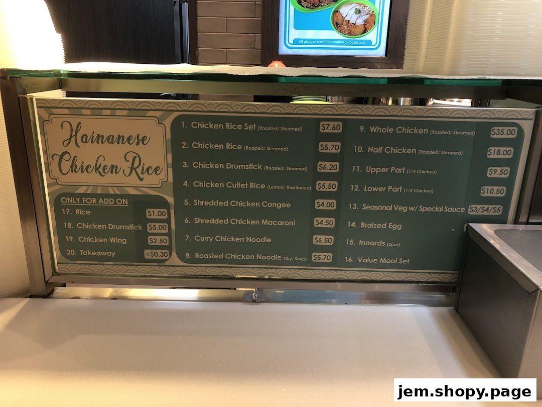 A menu board displaying Hainanese Chicken Rice dishes and add-on options.