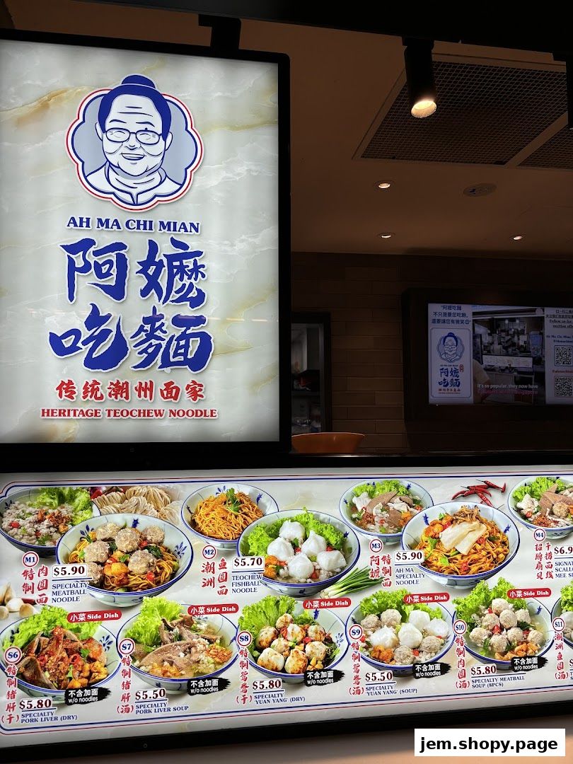 A food stall menu displaying various noodle dishes and side dishes with prices.