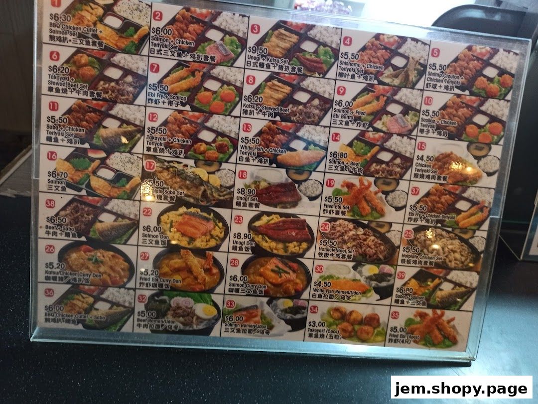 A menu board displaying various bento boxes and rice bowls with prices.