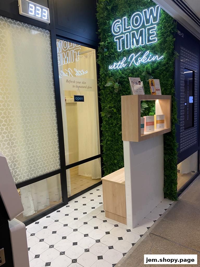 The entrance of Kskin Korean Express Facial with a neon sign and green wall.