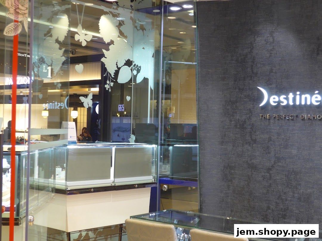 Lee Hwa Jewellery shop front with display cases and branded wall.
