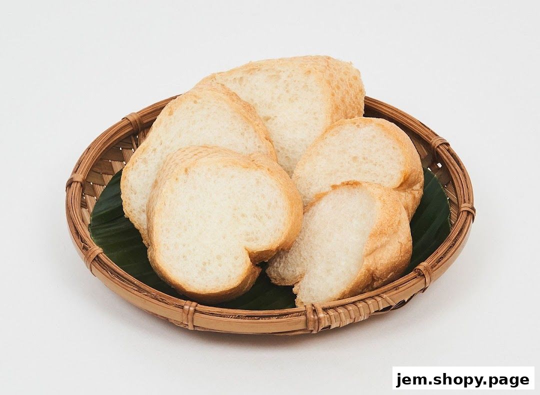 Slices of bread served in a woven basket on a banana leaf.